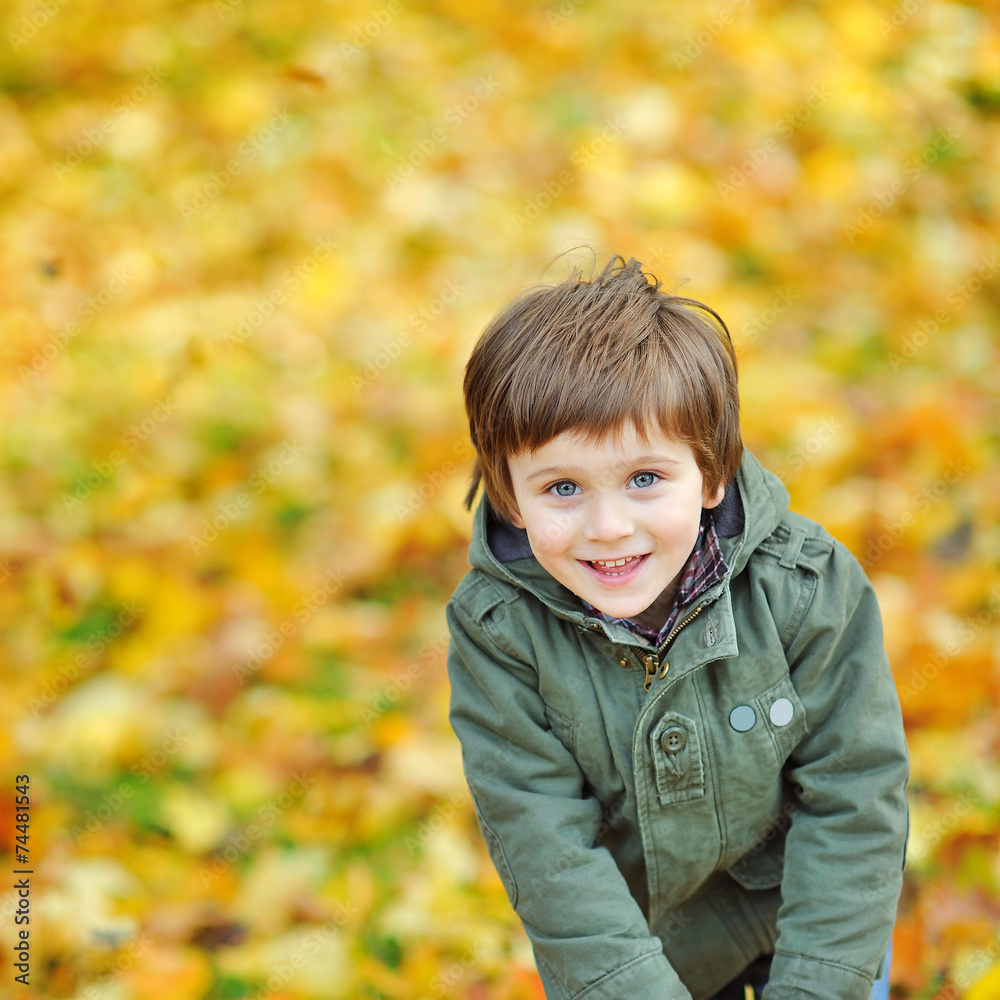 Portrait of playful little boy in the park