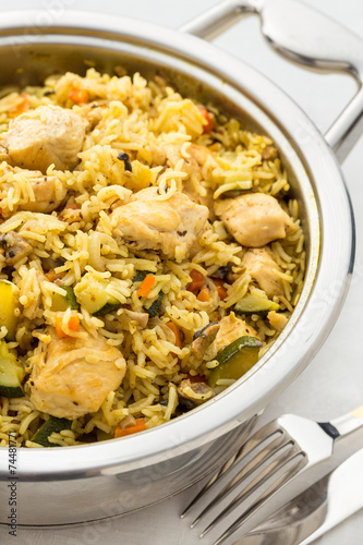 prepared pilaf with rice and chicken in pan