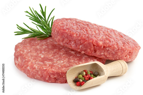 raw burgers, rosemary and pepper