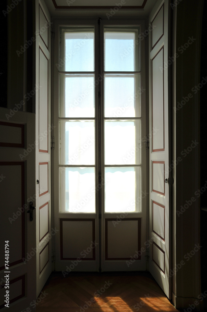 window door; view from inside of a classic Italian villa window door; view from inside of a classic Italian villa