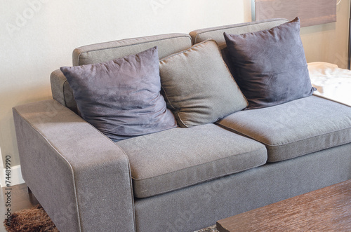 black sofa in livivng room with wooden table photo