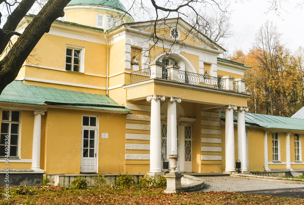 The old mansion in the park in autumn