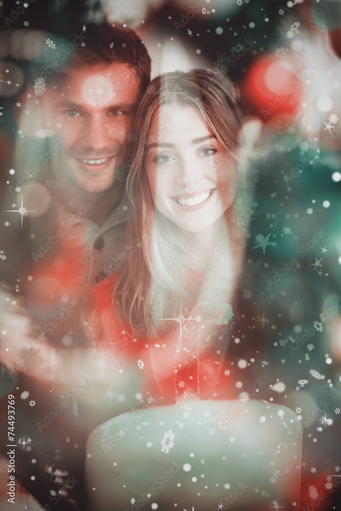 Composite image of happy couple holding each other Composite image of happy couple holding each other