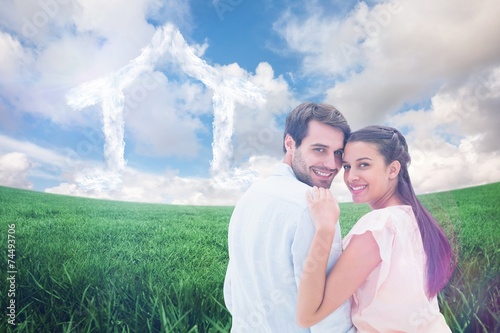 Composite image of attractive young couple smiling at camera