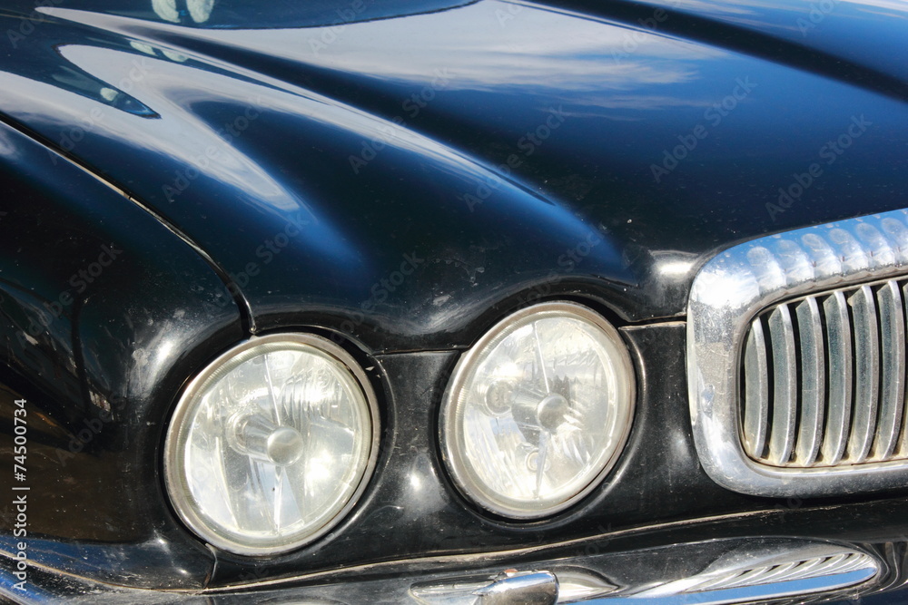 Black Car bonnet and round Headlights jaguar automobile	