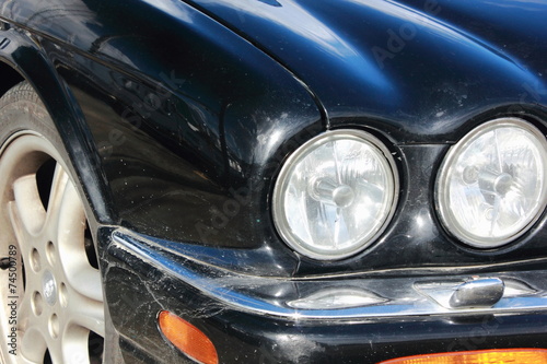 Black Car bonnet and round Headlights jaguar automobile 