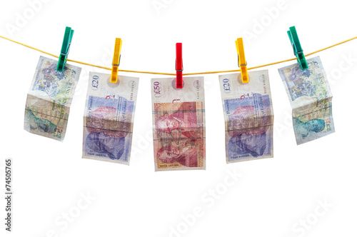English pounds banknotes on clothesline