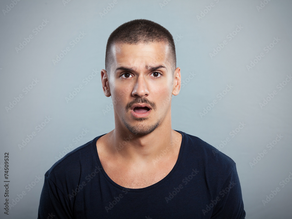 Fototapeta premium Studio shot of shocked young man 