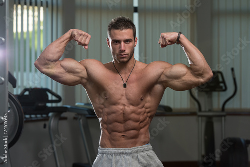Young Man Performing Front Double Biceps Pose