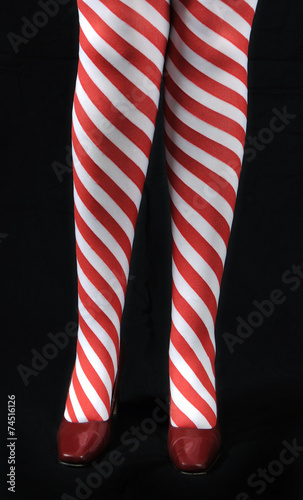 Lady Santa with red white candy cane stocking legs