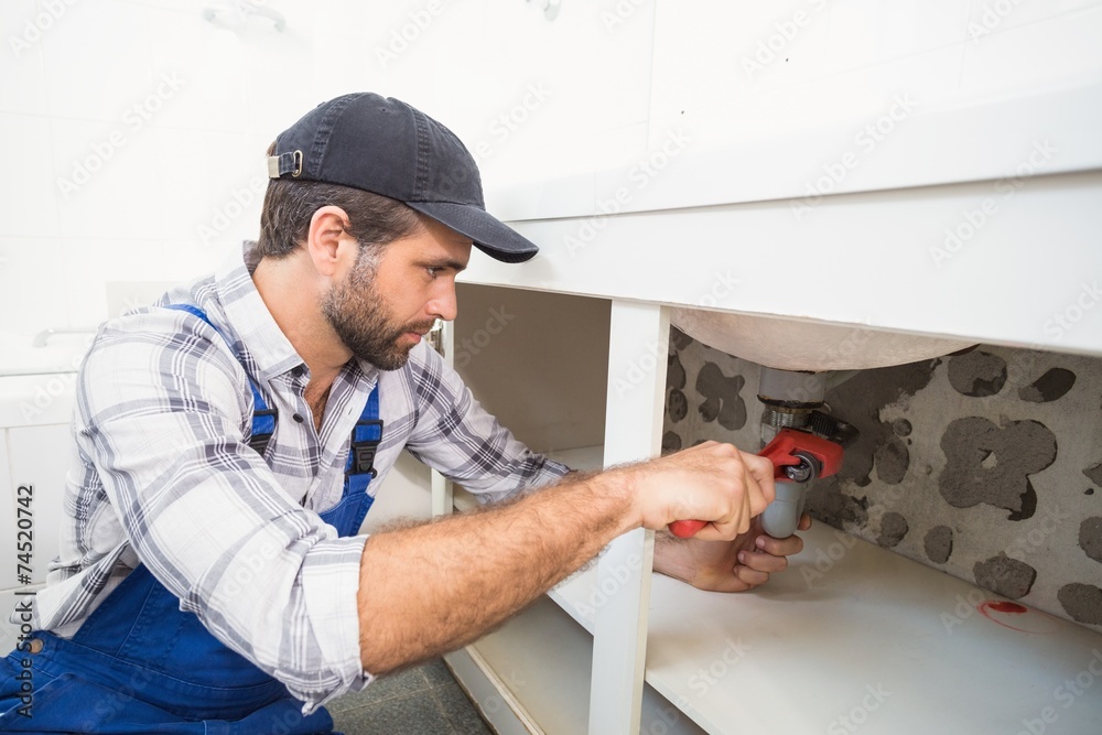 Plumber fixing under the sink Plumber fixing under the sink