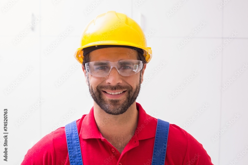 Construction worker smiling at camera Construction worker smiling at camera