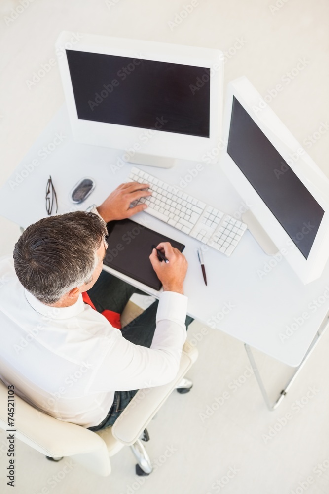 Businessman using computer and tablet Businessman using computer and tablet