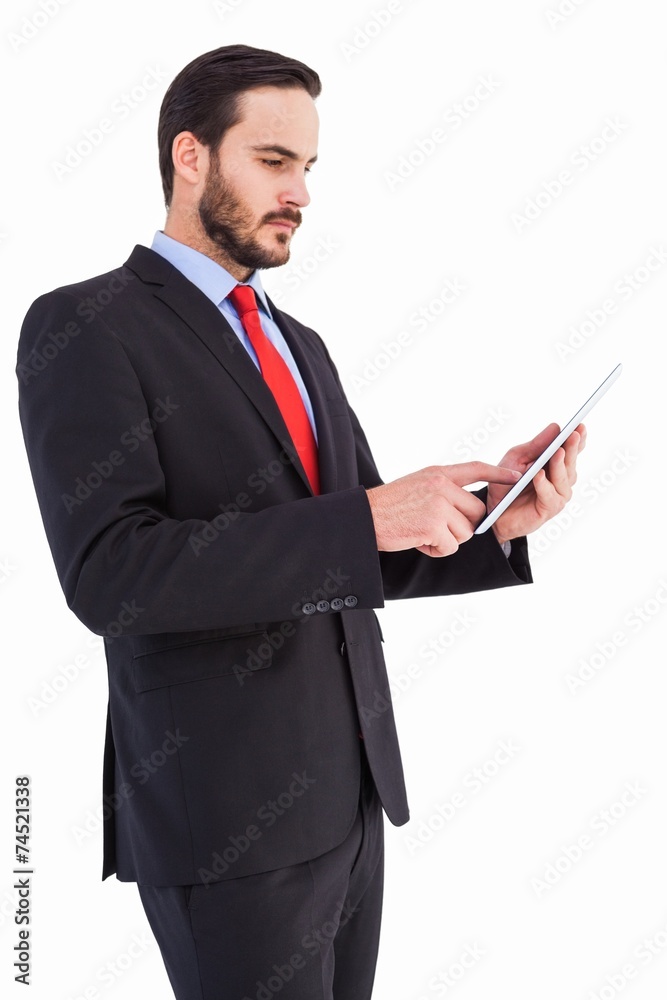 Businessman scrolling on his digital tablet Businessman scrolling on his digital tablet