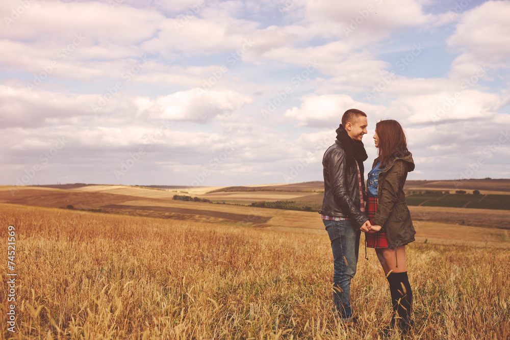 Landscape portrait of young beautiful stylish couple sensual and Landscape portrait of young beautiful stylish couple sensual and