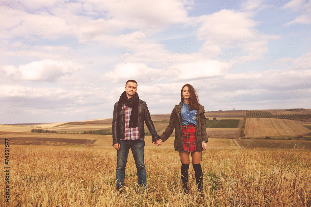 Landscape portrait of young beautiful stylish couple sensual and Landscape portrait of young beautiful stylish couple sensual and