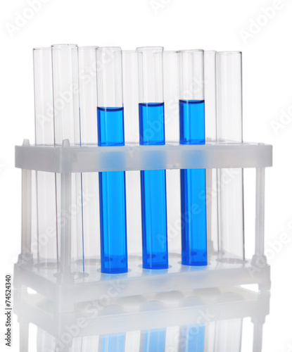 Test-tubes in container with colorful fluid isolated on white
