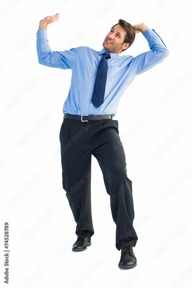 Focused businessman lifting up something heavy Focused businessman lifting up something heavy