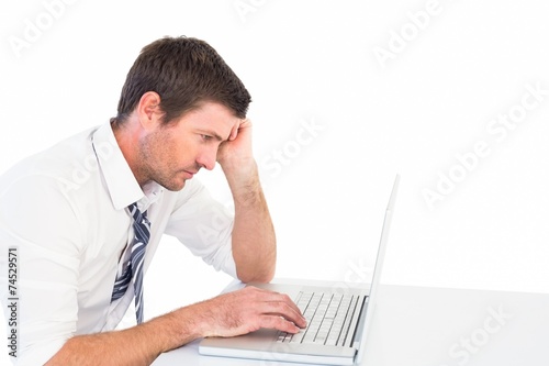 Focused businessman working on his laptop