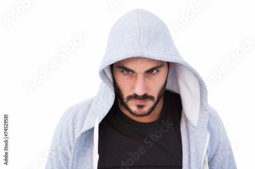 Portrait of dangerous man wearing hooded jacket