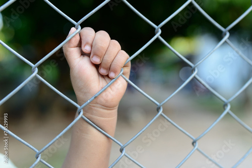 child's hand in jail.