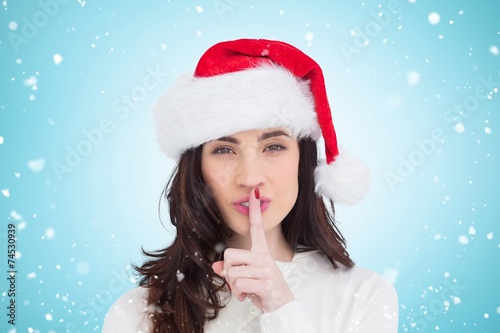 Canvas Print Composite image of festive brunette keeping a secret