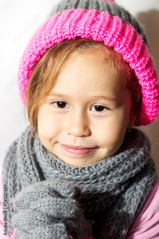 Little girl in winter hat with gloves and scarf. Little girl in winter hat with gloves and scarf.
