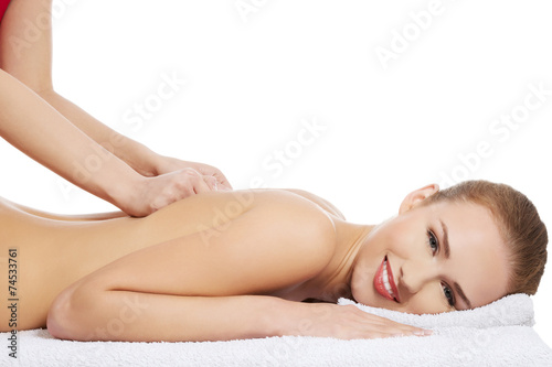 Woman relaxing in spa by getting massage