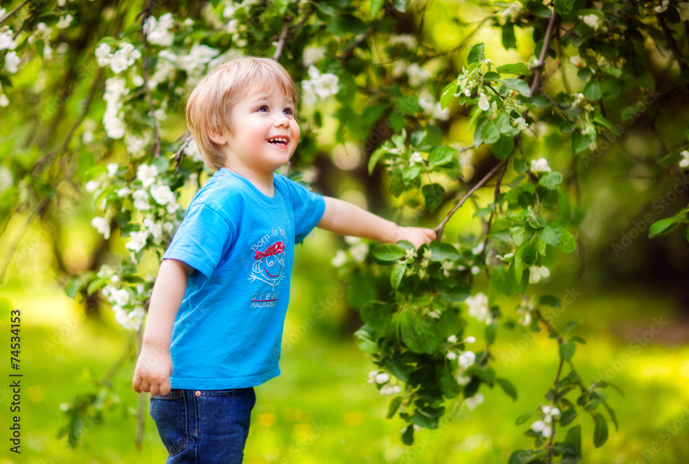 Boy in a lush garden