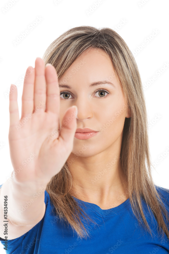 Portrait of a woman gesturing stop sign Portrait of a woman gesturing stop sign