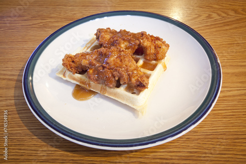 Chicken and waffles covered with a maple bourbon sauce.