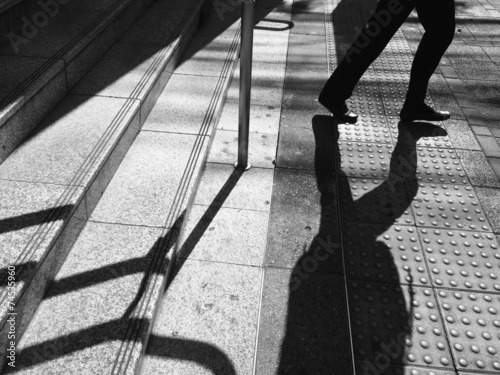man stepping down the stair photo