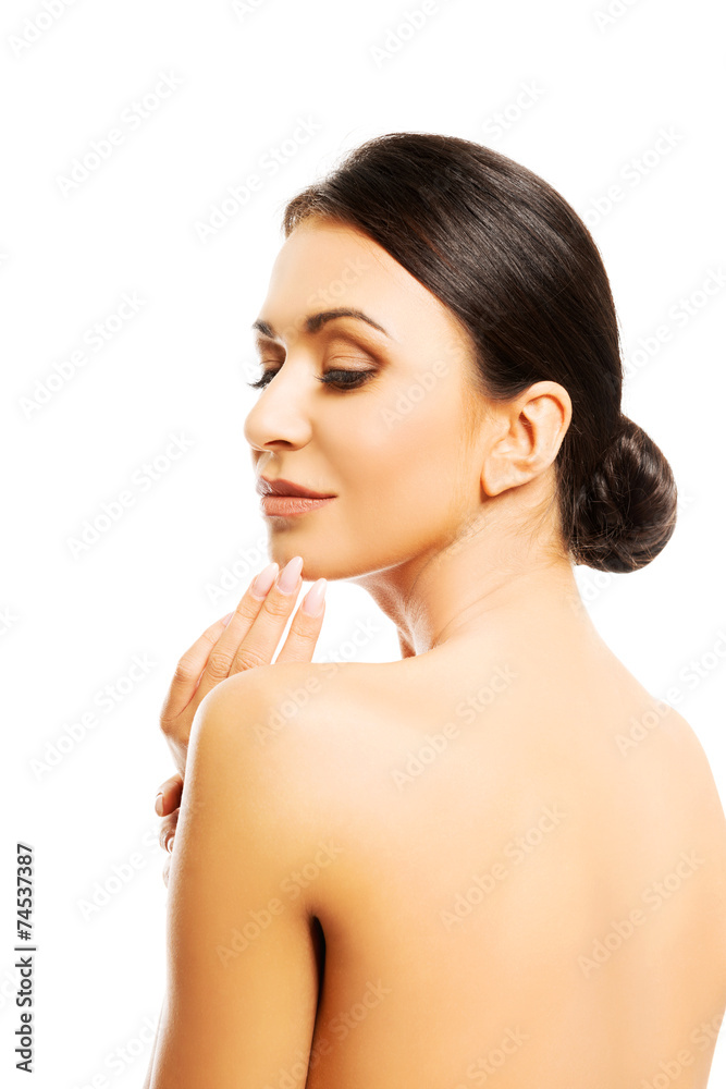 Obraz premium Back view of naked woman touching her chin