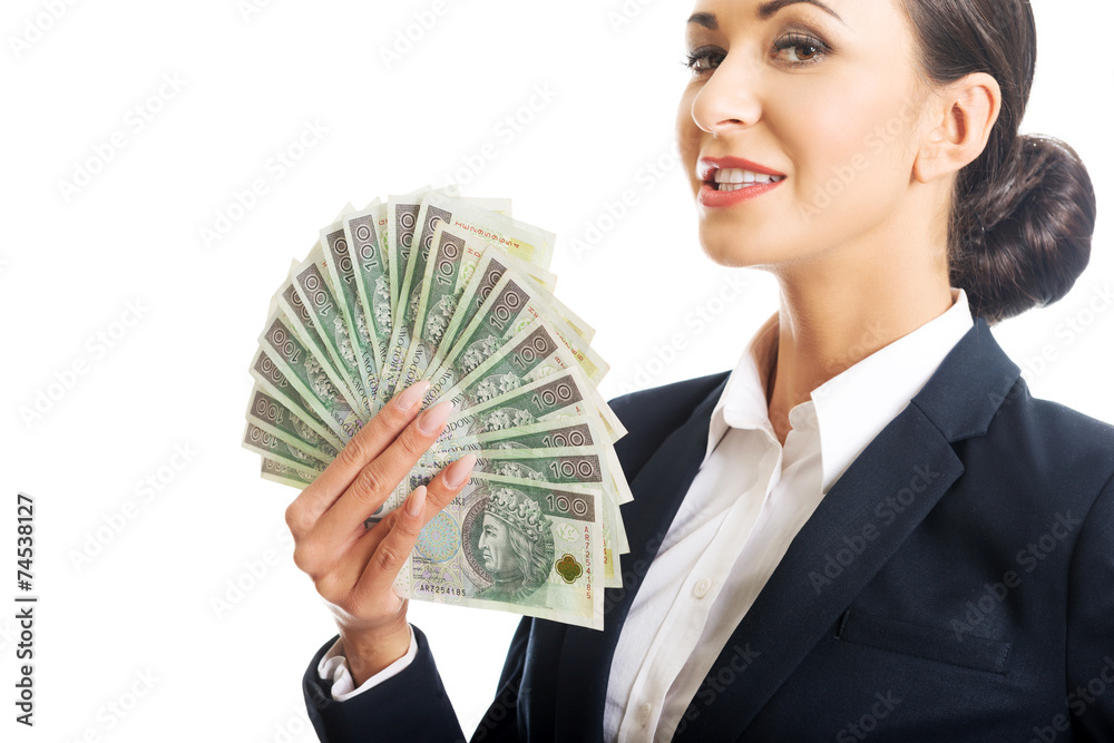 Portrait businesswoman holding a clip of polish money Portrait businesswoman holding a clip of polish money