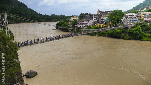 Crowd Across the Bridge in India