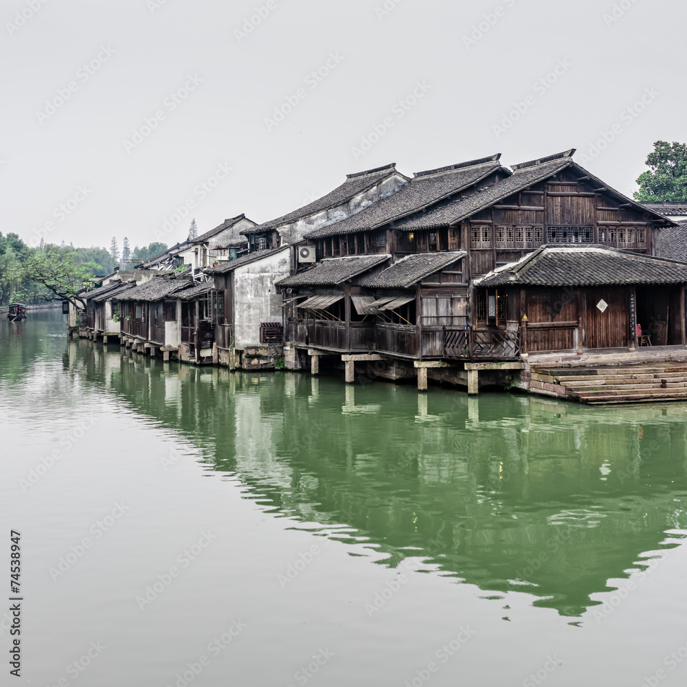 Chinese wood houses besides the river Chinese wood houses besides the river