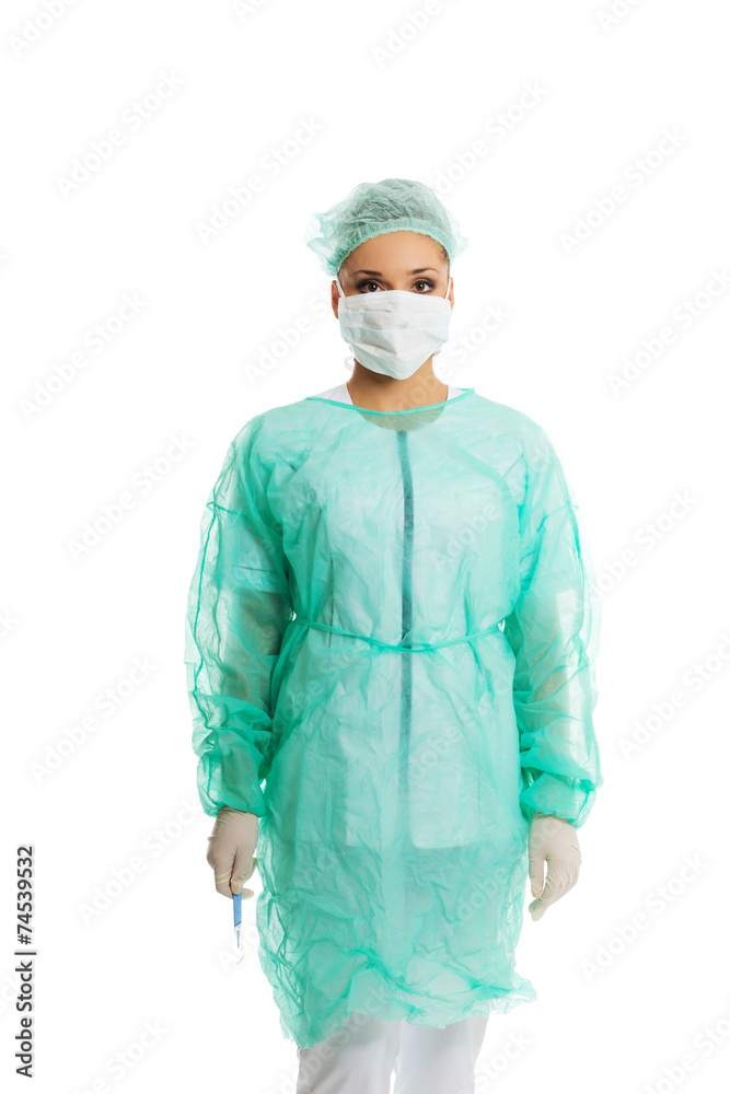 Full length female doctor with a scalpel Full length female doctor with a scalpel