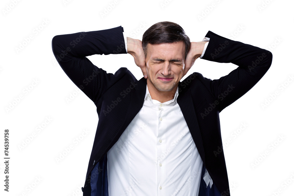 Businessman holding hands on the ears over white background Businessman holding hands on the ears over white background