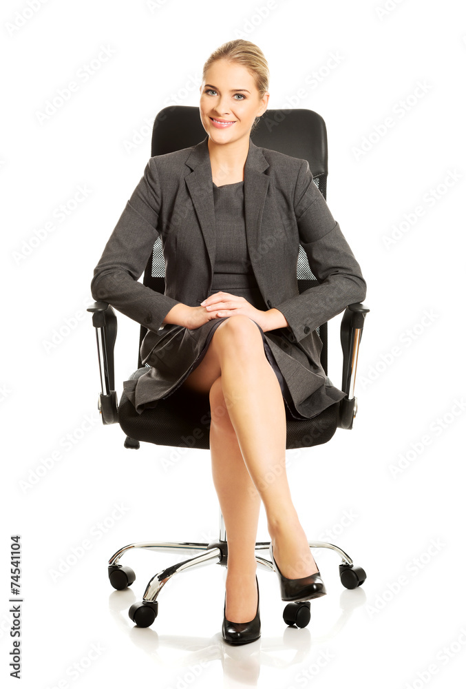 Businesswoman sitting on armchair Businesswoman sitting on armchair