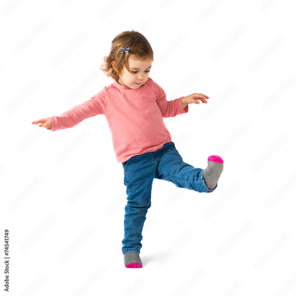 Little girl walking over white background Little girl walking over white background