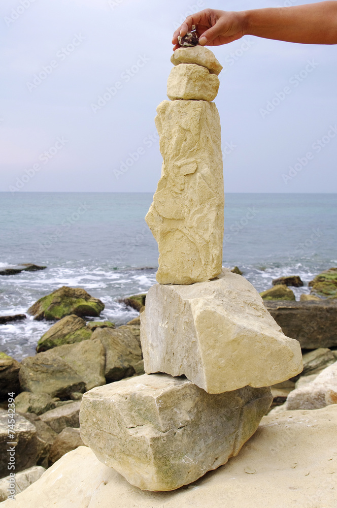 Stone fancy shaped face on beach Stone fancy shaped face on beach