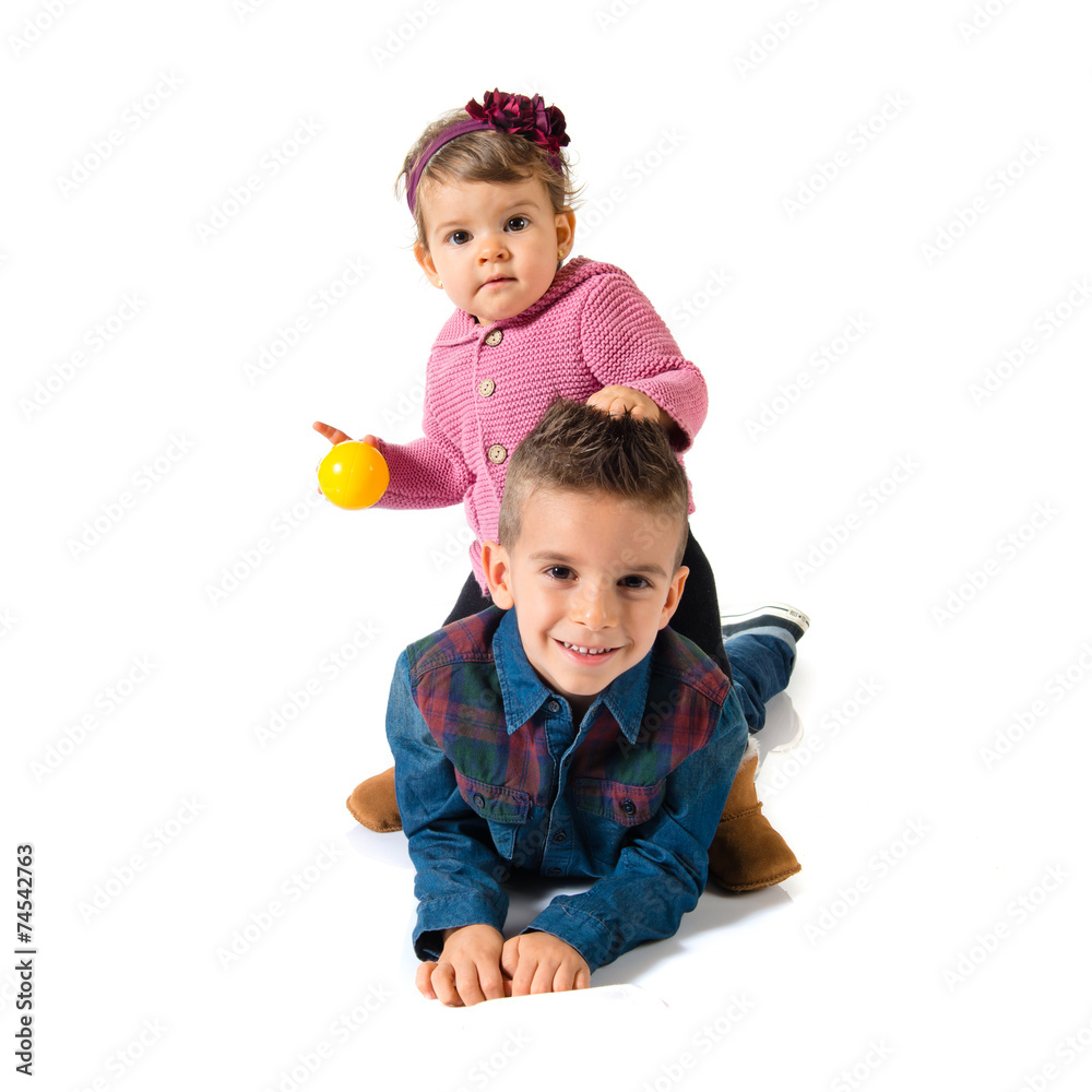 Brothers playing over white background Brothers playing over white background