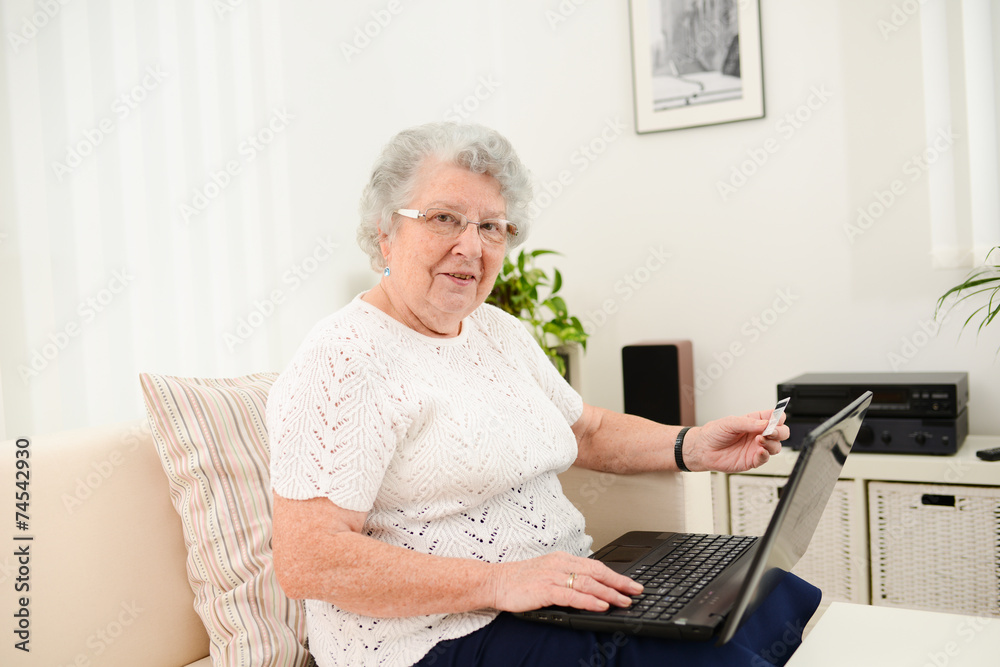 cheerful elderly woman websurfing and shopping internet laptop cheerful elderly woman websurfing and shopping internet laptop