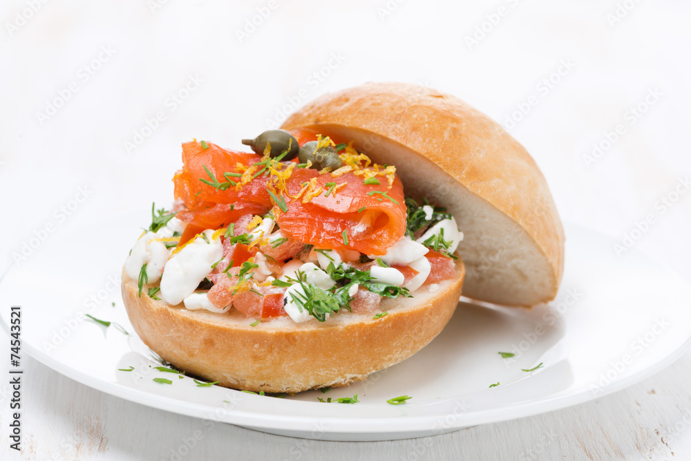 sandwich with cheese, tomato and salmon on the white plate sandwich with cheese, tomato and salmon on the white plate