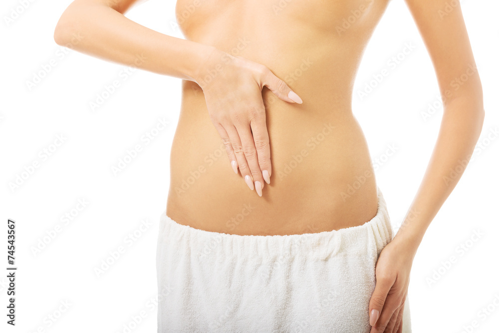 Woman touching her slim belly