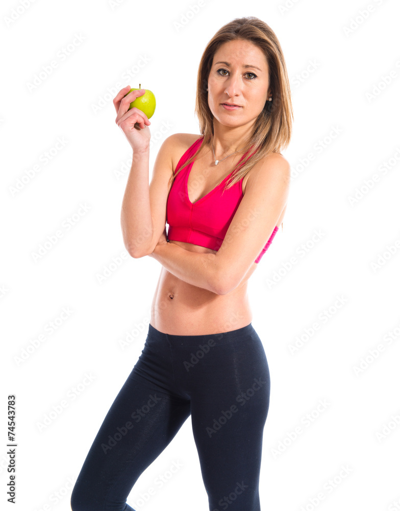 Sport woman holding an apple Sport woman holding an apple