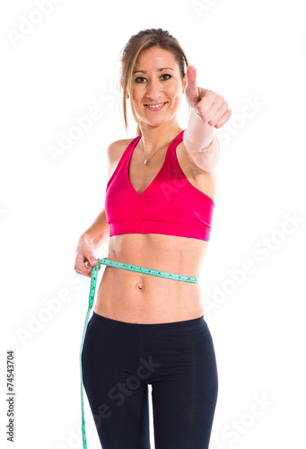 Slim woman with tape measure