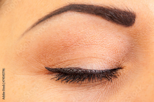 close female eye with make-up, closeup photo