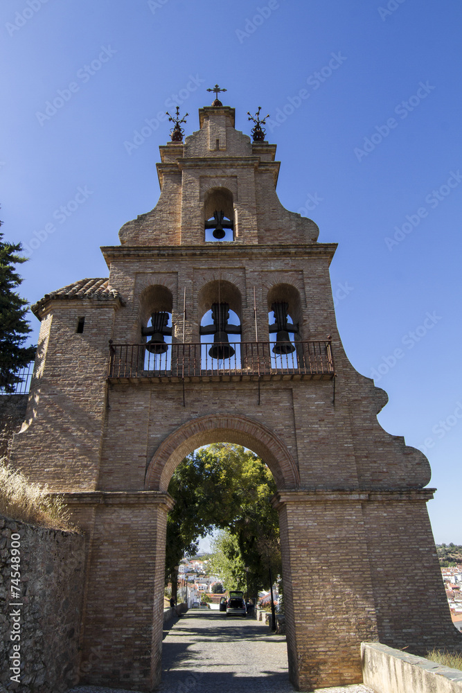 arc bell tower entrance located in Aracena, Spain.