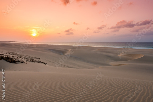 Sunset on sand dunes  in Chaves beach Praia de Chaves in Boavist